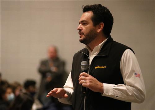 Man from Continental Tire speaks to sophomores at Clinton High School